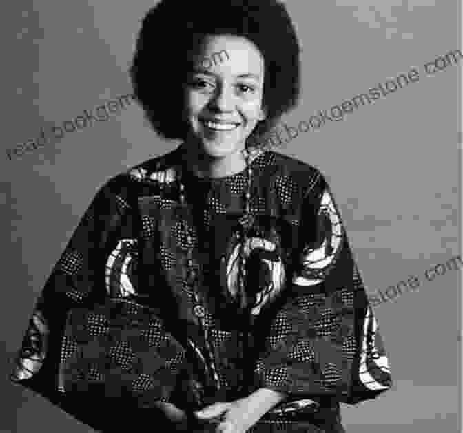 A Black And White Photograph Of Nikki Giovanni Wearing A Floral Dress And Looking Directly At The Camera. Love Poems Nikki Giovanni