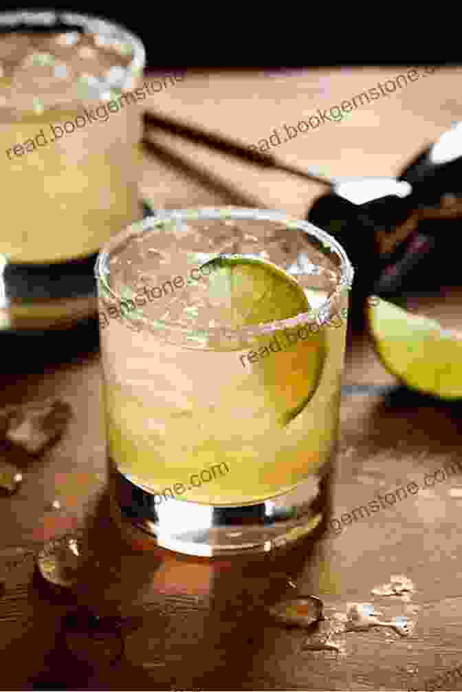 A Luxurious Margarita Served In A Rocks Glass, Garnished With A Lime Wedge And A Grand Marnier Float Top 5 Margaritas In Los Cabos 2024