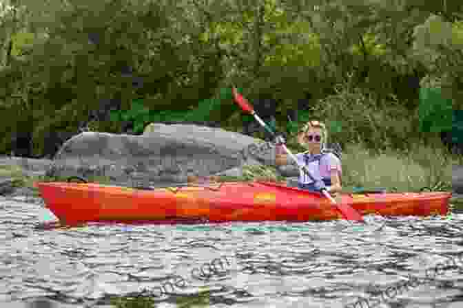 A Young British Woman Kayaking In A Remote Wilderness Area The Adventures Of The British Citizens