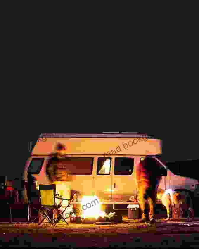Pete Buckley Sitting Outside His Campervan At Night With A Campfire Burning In The Foreground And A Starry Sky Above 31 Days In A Campervan Pete Buckley